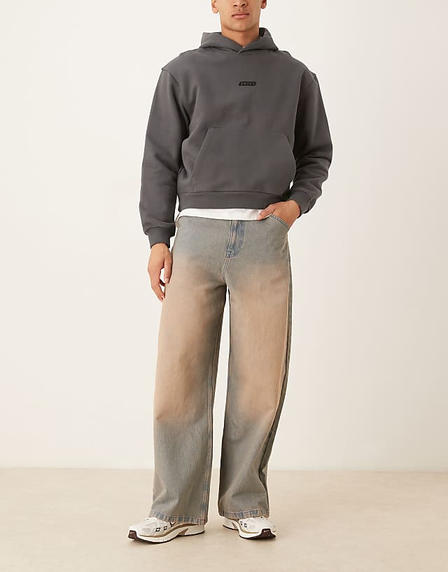 asos ASOS DESIGN super baggy jeans with heavy red tint in mid wash blue