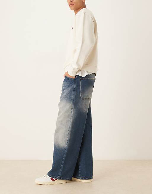 Asos ASOS DESIGN Super Baggy Jeans With Raw Edge In Washed Indigo