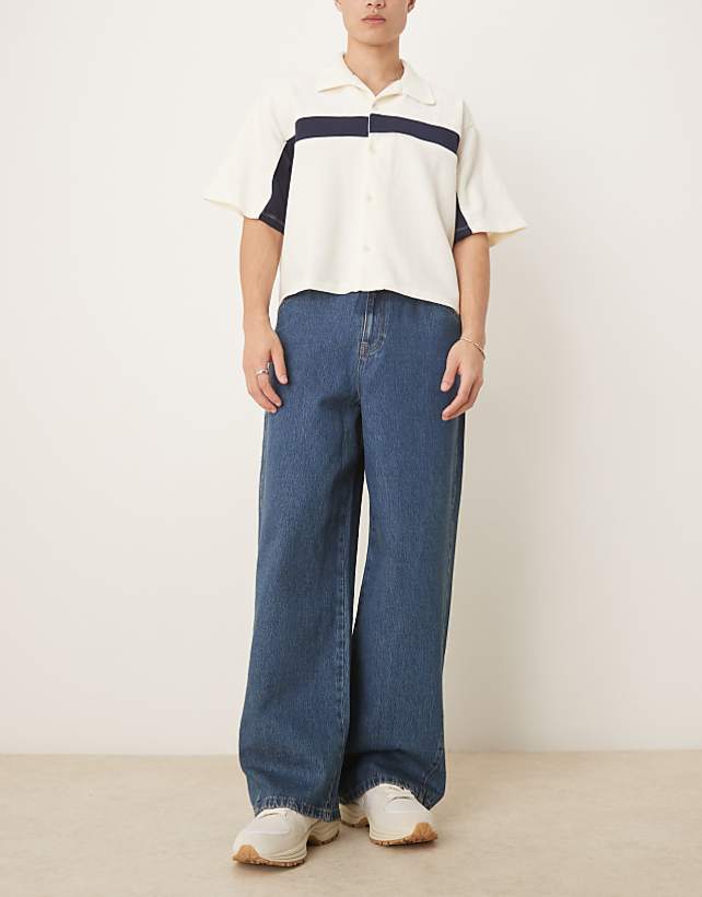 asos ASOS DESIGN super baggy jeans with twisted seams in mid wash blue
