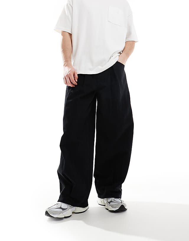 asos ASOS DESIGN super baggy trousers in black with pleat detailing