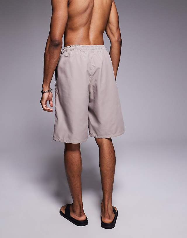 Asos ASOS DESIGN Swim Shorts In Long Length In Beige