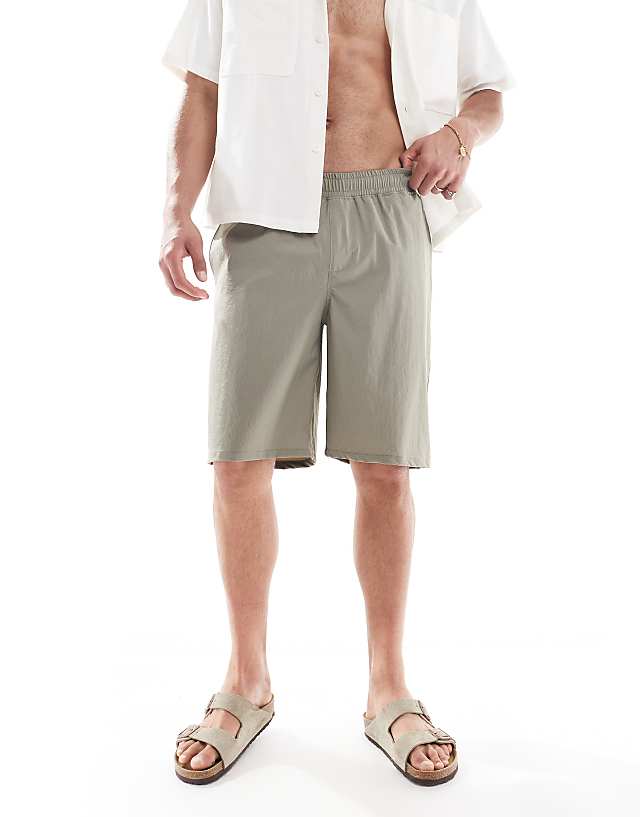 Asos ASOS DESIGN Swim Shorts In Long Length In Sage Green