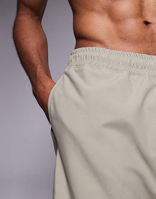 Asos ASOS DESIGN Swim Shorts In Mid Length In Khaki
