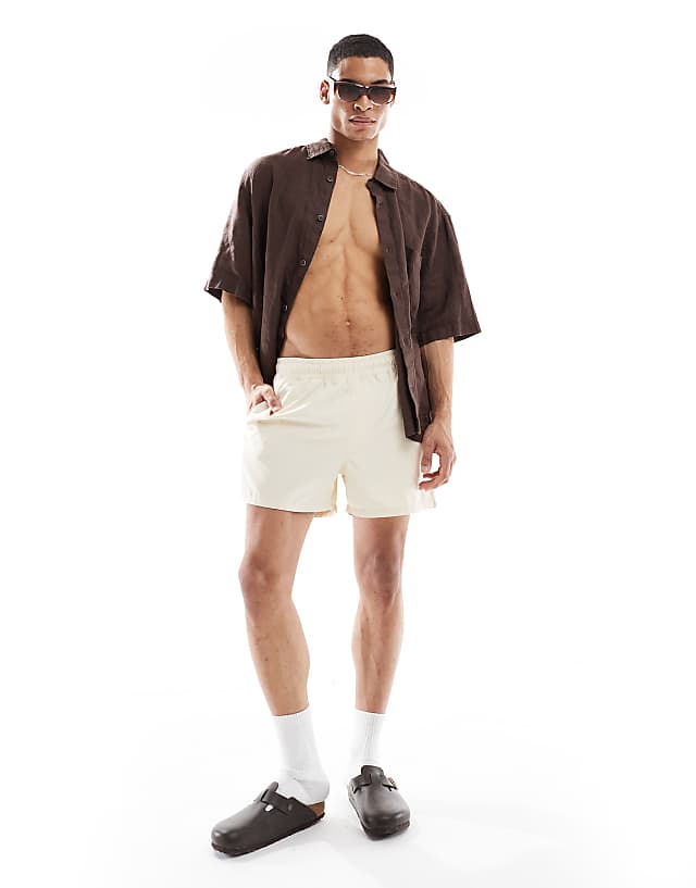 Asos ASOS DESIGN Swim Shorts In Short Length In Beige