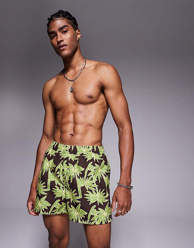 asos ASOS DESIGN swim shorts in short length in black palm tree print