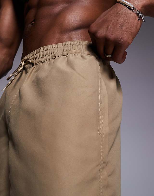 Asos ASOS DESIGN Swim Shorts In Short Length In Dark Stone