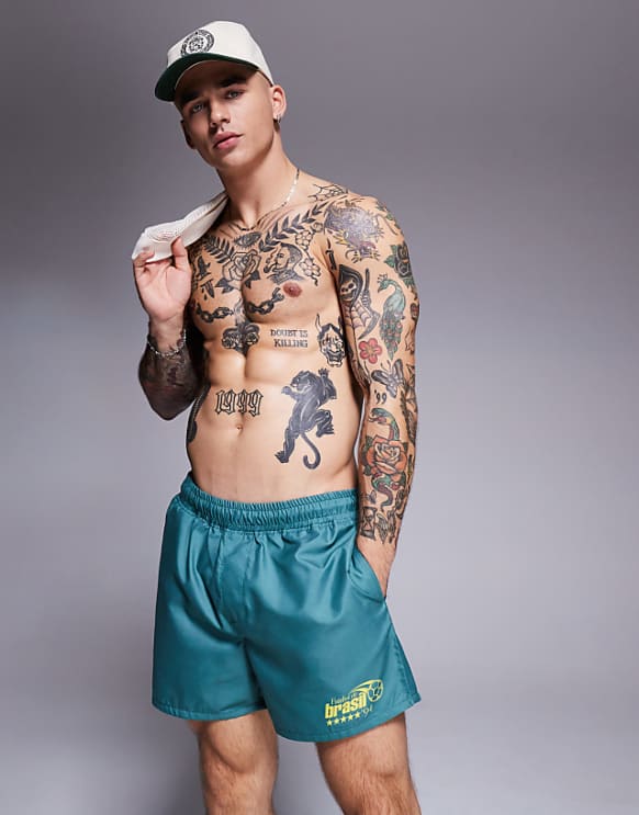 asos ASOS DESIGN swim shorts in short length with placement print in green