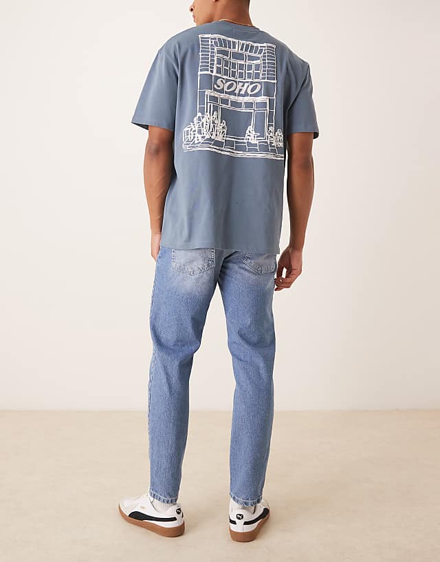 Asos ASOS DESIGN Tapered Fit Jeans In Light Wash Blue