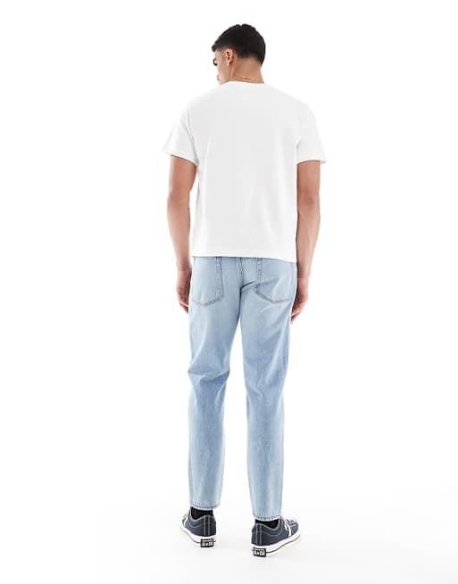 Asos ASOS DESIGN Tapered Jeans In Vintage Light Blue Wash