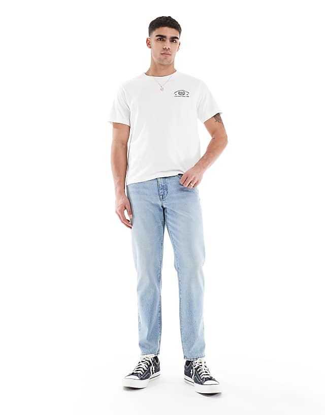 asos ASOS DESIGN tapered jeans in vintage light blue wash