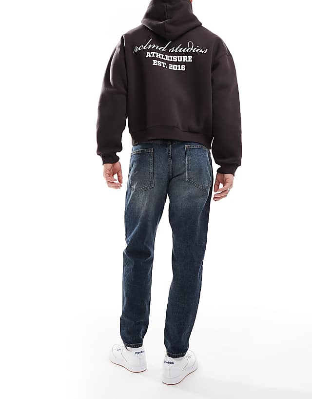 Asos ASOS DESIGN Tapered Jeans With Vintage Tint In Dark Wash Blue