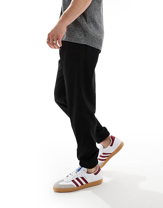 Asos ASOS DESIGN Tapered Smart Trousers With Jogger Cuff In Black