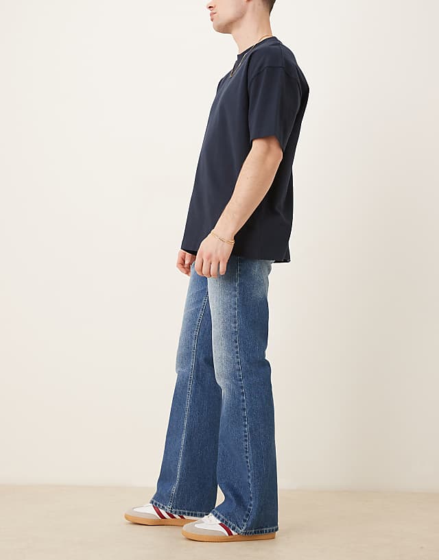 Asos ASOS DESIGN Vintage Flare Jeans In Mid Wash Blue