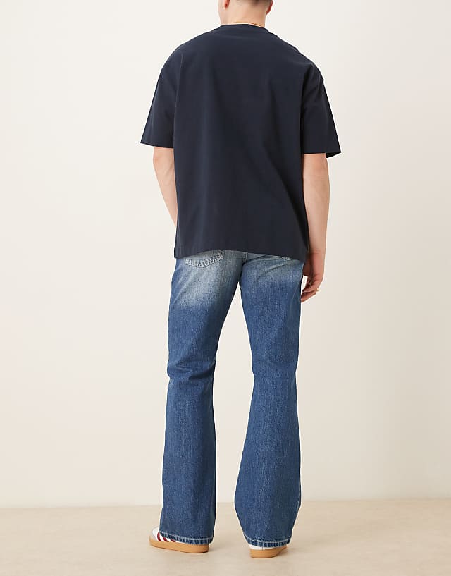 Asos ASOS DESIGN Vintage Flare Jeans In Mid Wash Blue
