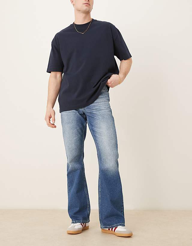asos ASOS DESIGN vintage flare jeans in mid wash blue