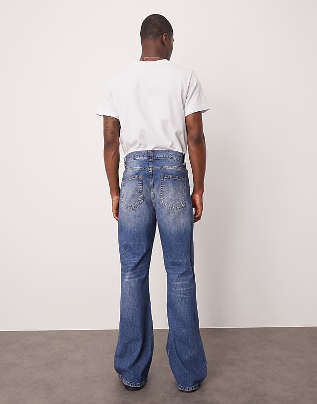 Asos ASOS DESIGN Wide Flare Jeans With Tint In Light Wash Blue