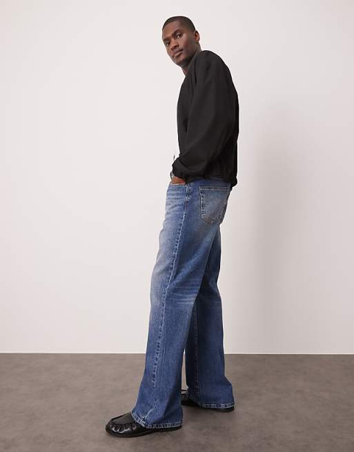Asos ASOS DESIGN Wide Flare Jeans With Tint In Light Wash Blue