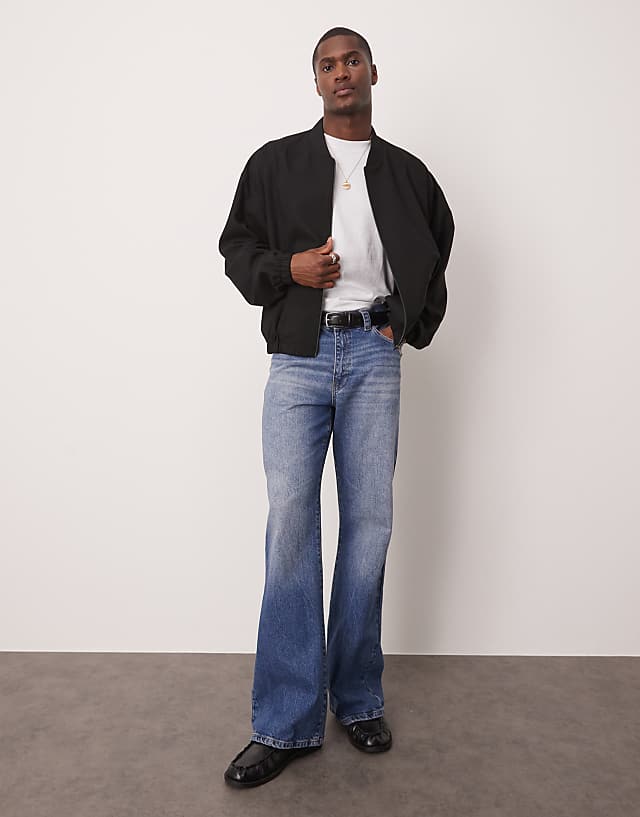 asos ASOS DESIGN wide flare jeans with tint in light wash blue