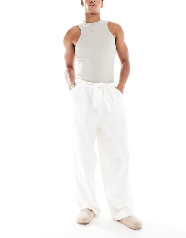 asos ASOS DESIGN wide leg belted trousers with front pleats in ecru canvas
