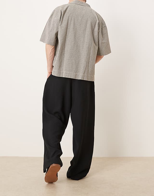 Asos ASOS DESIGN Wide Leg Smart Trousers With Front Pleat In Black
