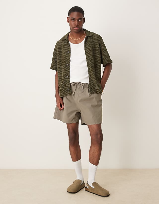 asos ASOS DESIGN wide shorter length shorts in khaki with pleats and drawstring