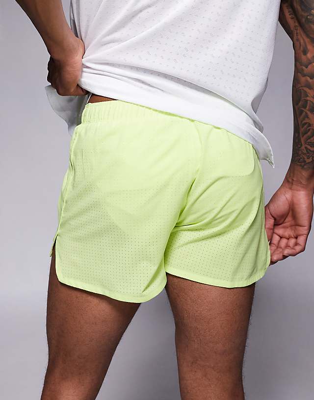 Asos Nike Running Dri-FIT 3 Inch Shorts In Yellow