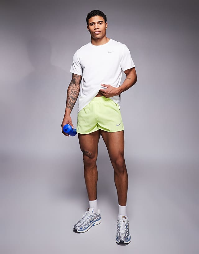 asos Nike Running Dri-FIT 3 inch shorts in yellow