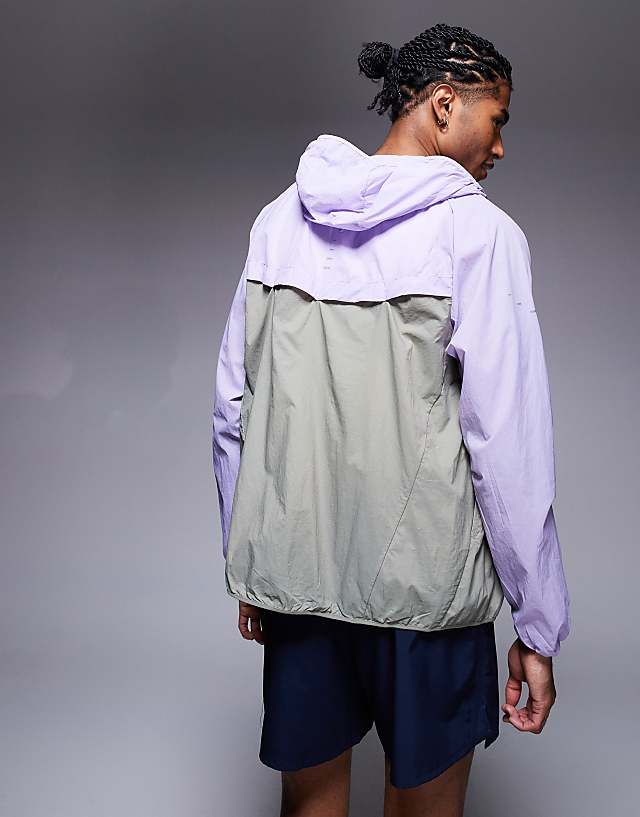 Asos Nike Running Stride Repel Jacket In Lilac