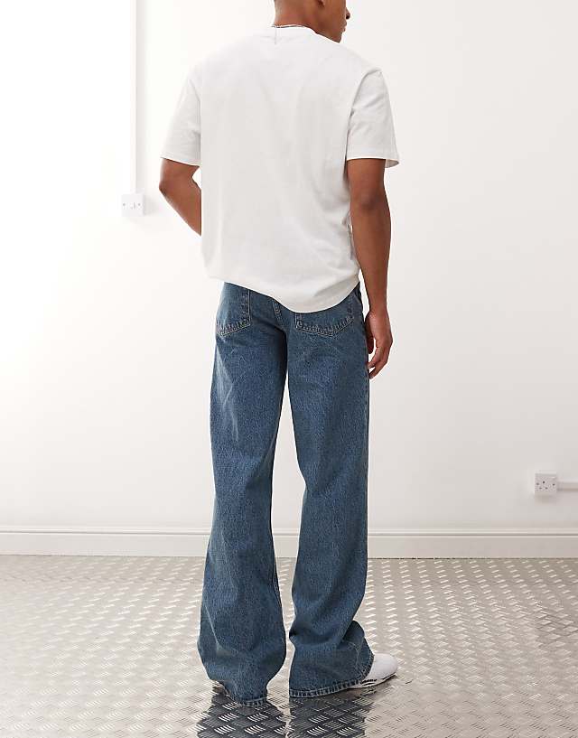 Asos COLLUSION Flare Jean In Mid Wash And Tobacco Stitching