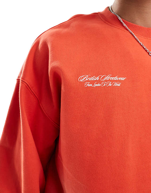 Asos Criminal Damage Spray Varsity Sweatshirt In Washed Red