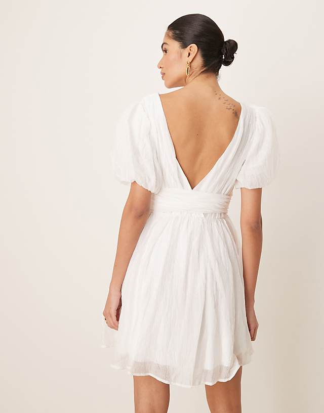 Asos Gina Tricot Short Sleeve V Neck Open Back Bow Graduation Mini Dress In Off White