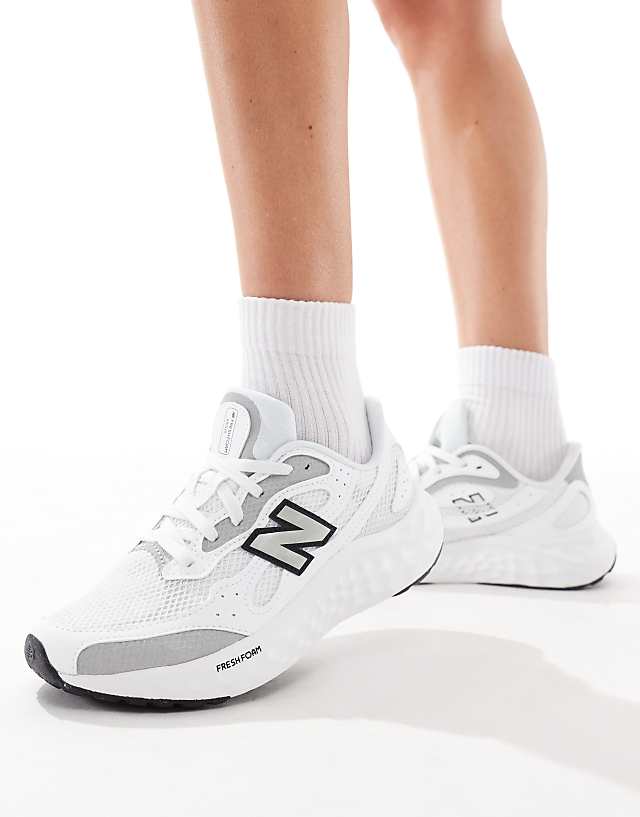 asos New Balance Arishi running trainers in white and silver
