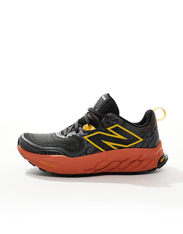 Asos New Balance Hierro Trail Running Trainers In Black And Orange