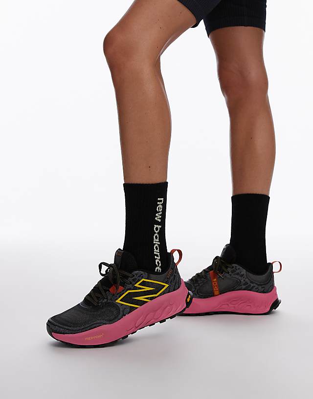 asos New Balance Hierro trail running trainers in black and pink