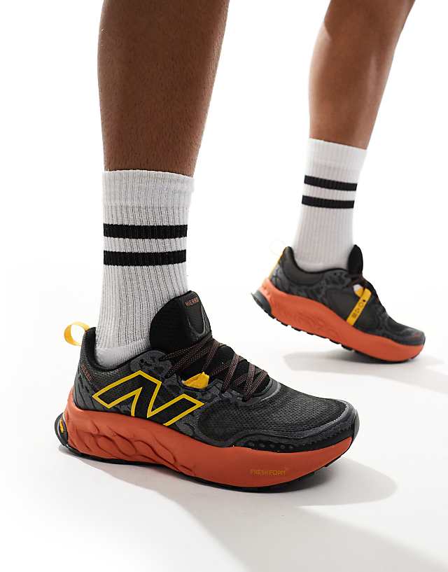 asos New Balance Hierro trail running trainers in black and orange