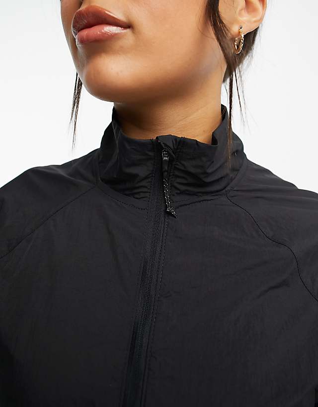 Asos New Balance Impact Run Packable Jacket In Black