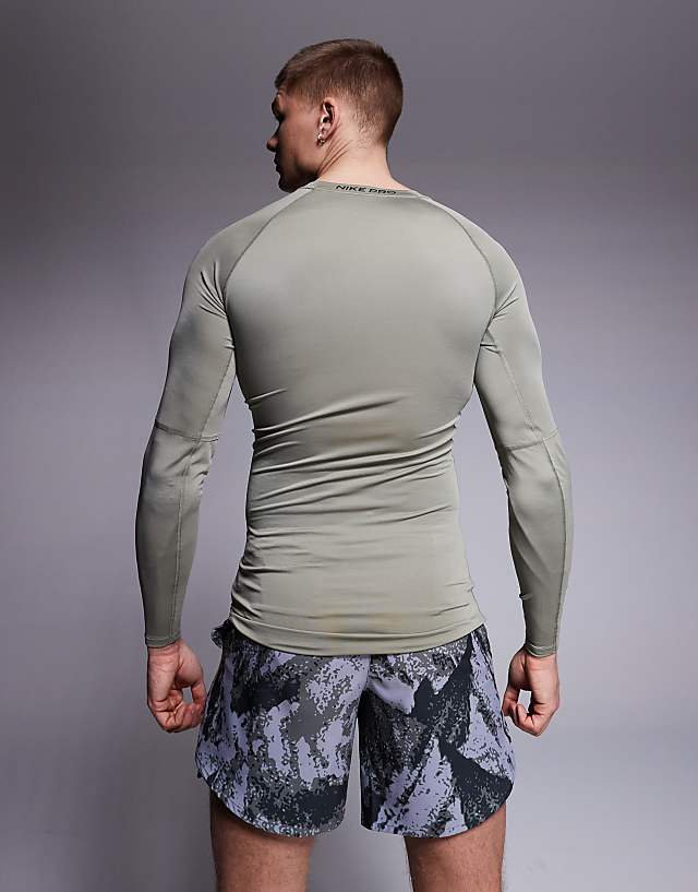 Asos Nike Pro Training Dri-FIT Muscle Fit Long Sleeve Top In Khaki