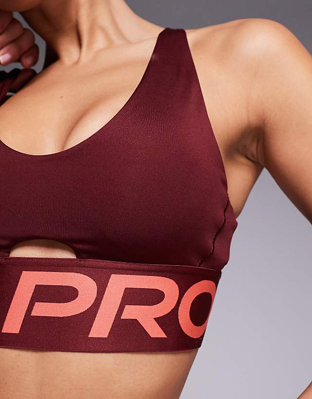 Asos Nike Pro Training Indy Dri-FIT Plunge Light Support Sports Bra In Burgundy