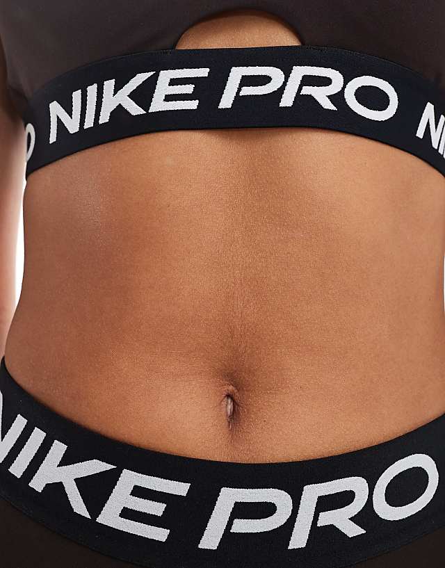 Asos Nike Pro Training Indy Medium Support Plunge Sports Bra In Brown
