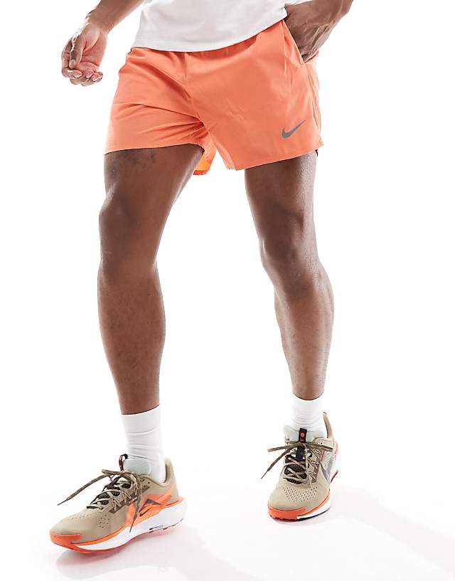 asos Nike Running Challenger Dri-FIT 5 inch shorts in orange