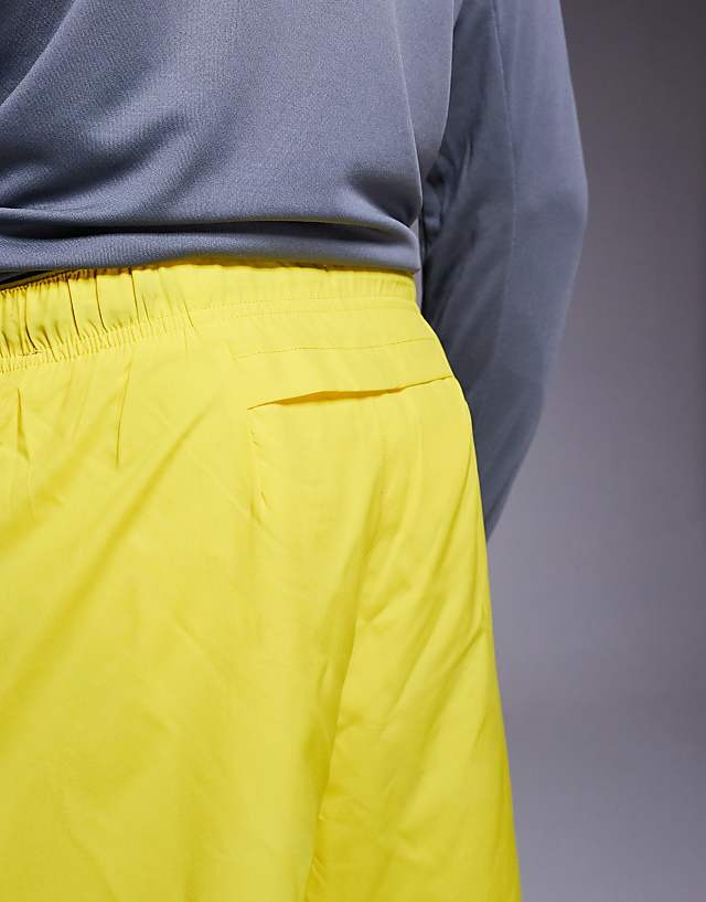 Asos Nike Running Challenger Dri-FIT 7 Inch Shorts In Yellow