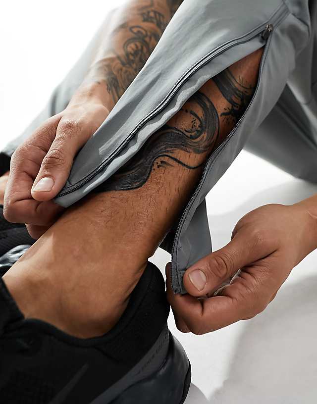 Asos Nike Running Challenger Dri-FIT Joggers In Grey