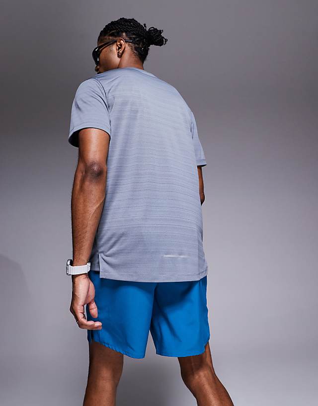 Asos Nike Running Dri-FIT Challenger 7 Inch Shorts In Blue