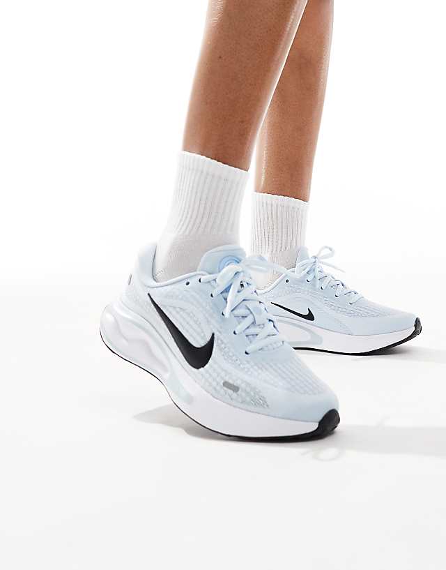 asos Nike Running Journey Run trainers in blue and white