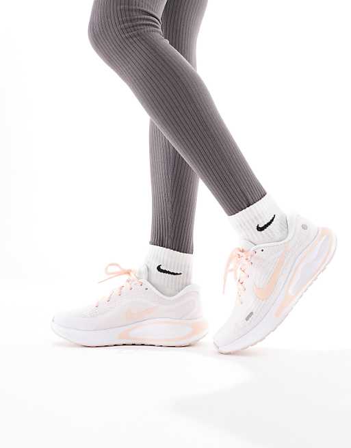 asos Nike Running Journey Run trainers in white and orange