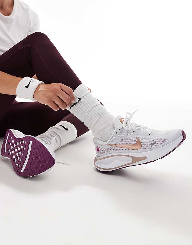 asos Nike Running Journey Run trainers in white and purple