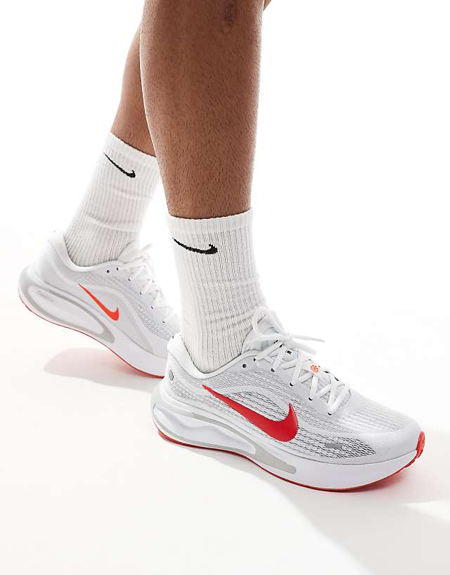 asos Nike Running Journey Run trainers in white and red