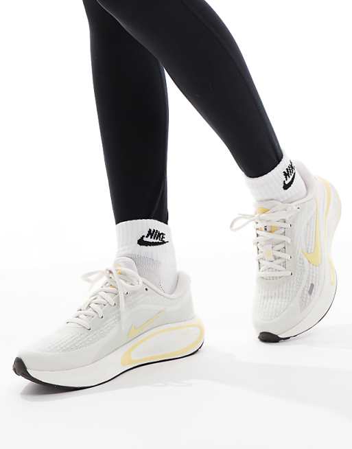 asos Nike Running Journey Run trainers in white and yellow