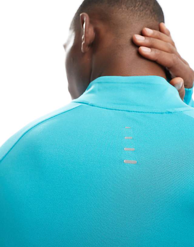 Asos Nike Running Stride Dri-FIT Half Zip Longsleeve Top In Turquoise
