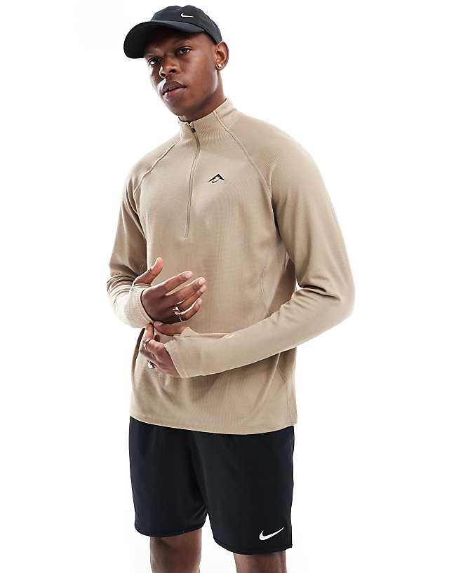 asos Nike Running Trail 1/4 zip sweatshirt in beige